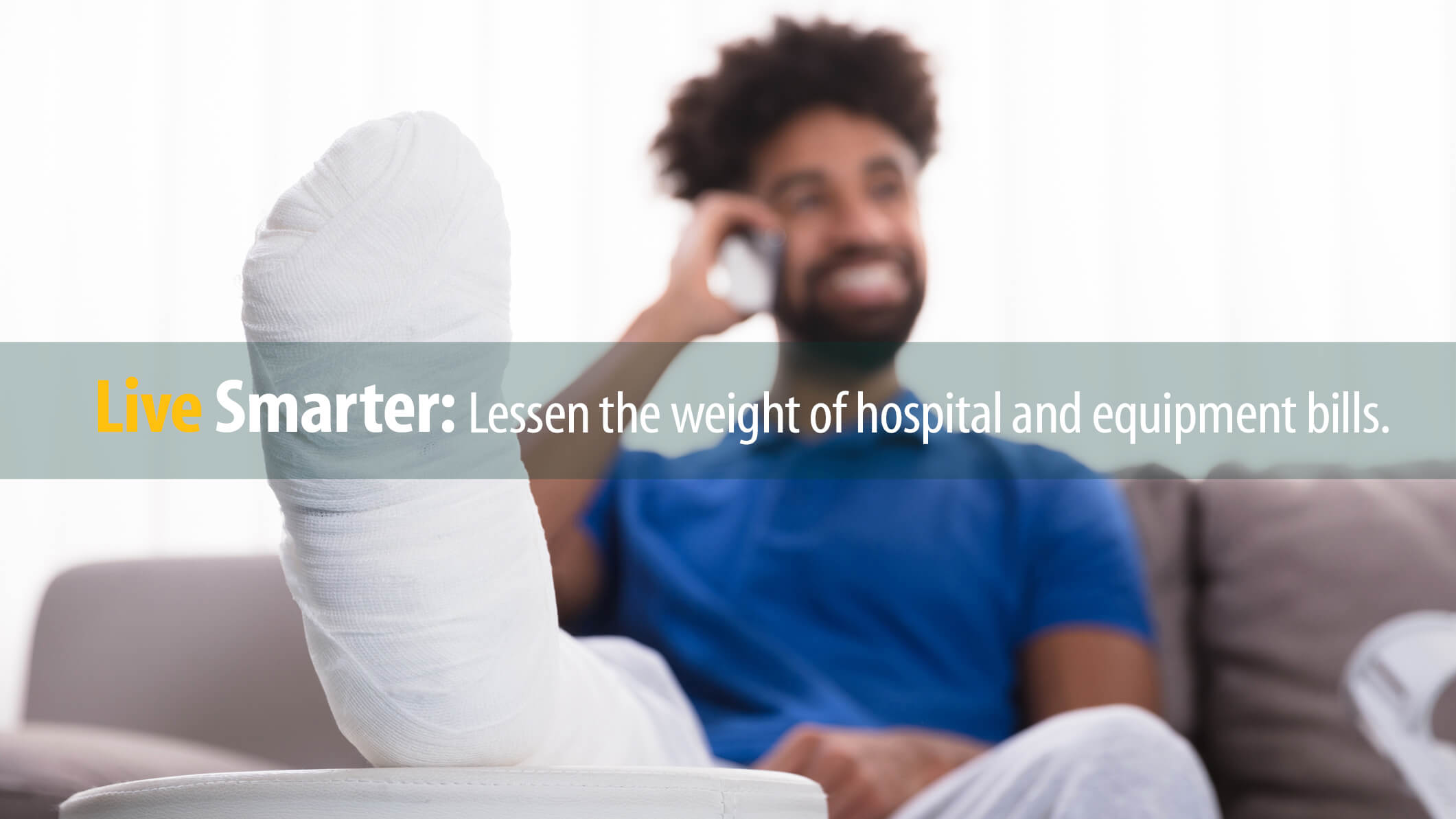 Patient with cast on foot talks happily on phone, knowing his bills will be manageable.